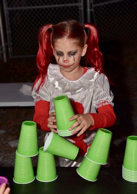 Marley Campanese is a fast cup stacker as she shows her skill during the Sussex Family YMCA Trunk-or-Treat. RON MACARTHUR PHOTO