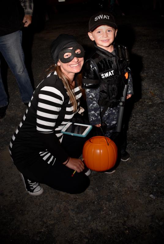 Officer Austin Coulter is a SWAT member who has his mother, Rebecca, in “custody” at the Sussex Family YMCA Halloween event. RON MACARTHUR PHOTO