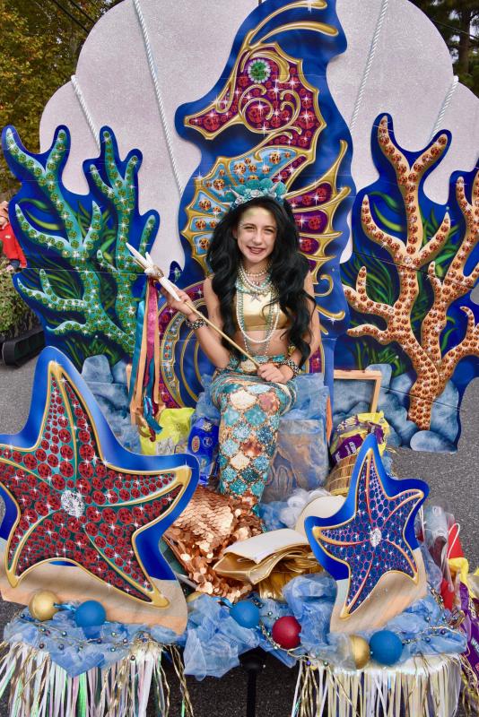 Parade prize-winner Leighanna Dougherty of Millville, N.J., is on a mermaid throne. RON MACARTHUR PHOTO