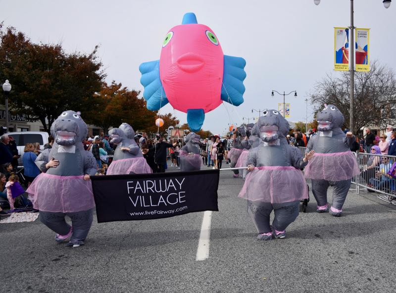 The Fairway Village dancing hippos provide laughs as they bounce along the parade route. RON MACARTHUR PHOTO