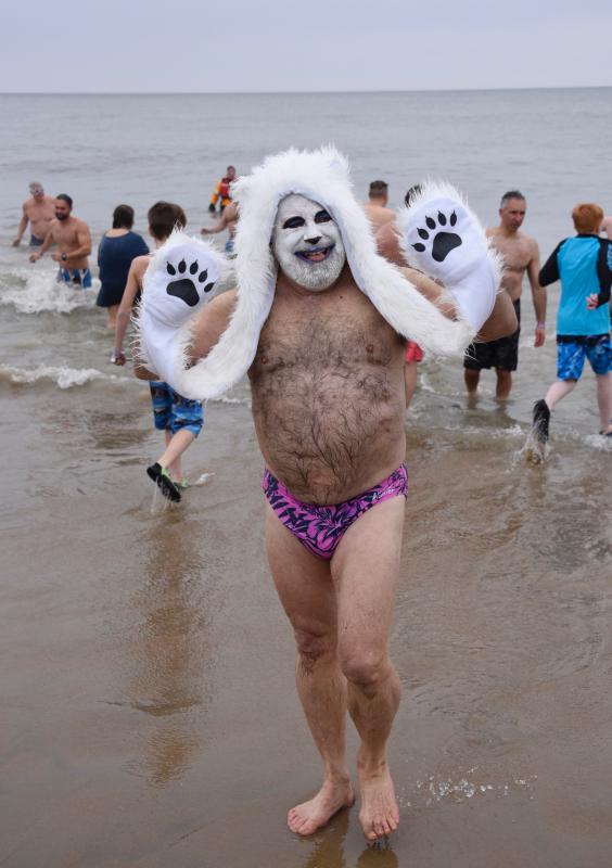 Peter Pizzologo of Rehoboth Beach and Washington, D.C., emerges from the chilly ocean. RON MACARTHUR PHOTO