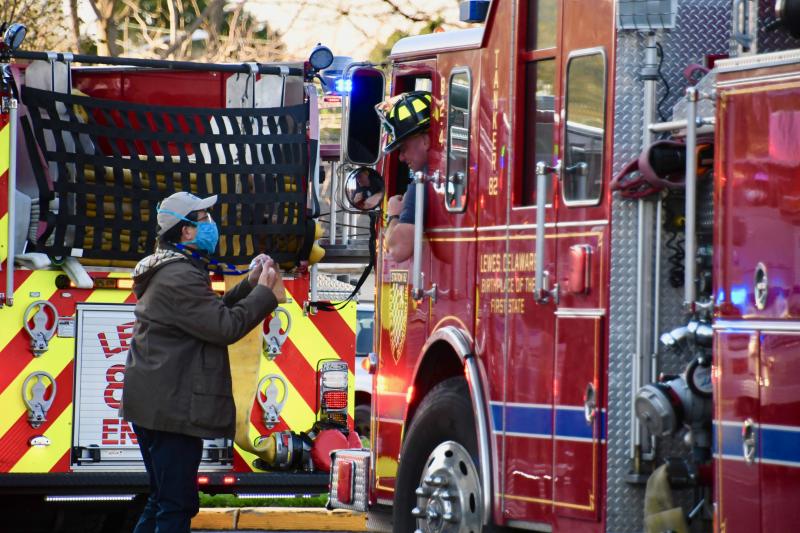 Beebe Healthcare President and CEO David Tam makes sure he thanks volunteer firefighters who take time to honor staff at the hospital. RON MACARTHUR PHOTO
