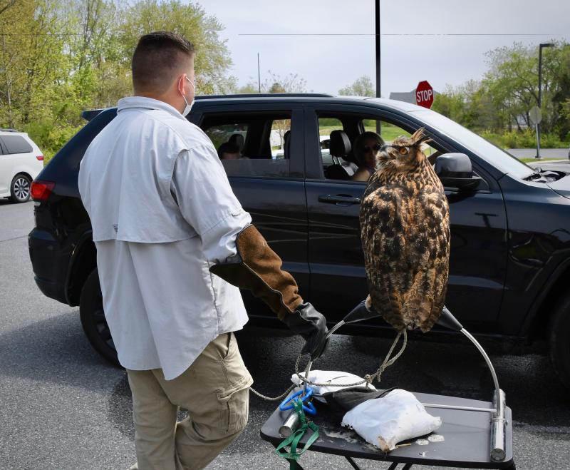 Barn Hill Preserve co-owner Josh Mueller answers questions about Zoey, an eagle owl, which is the largest of its species.