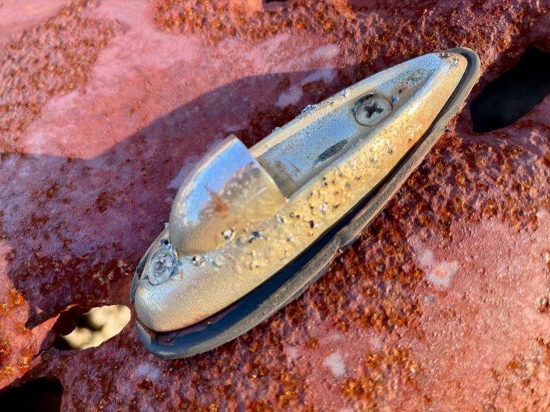 This chromed feature sits atop the front left fender of the vehicle, offering another obscure clue as to its identify.