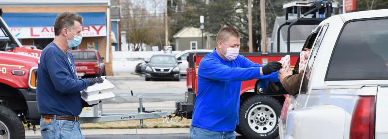 As with most other major events, the 84th annual Georgetown Fire Co. Oyster Eat fell victim to COVID-19 restrictions. Not to be deterred, volunteers retooled and offered drive-through oyster meals Feb. 27 with all the traditional trimmings. In the photo, Keith Bryan, left, and Penuel Barrett deliver food in the fire company’s parking lot. RON MACARTHUR PHOTOS