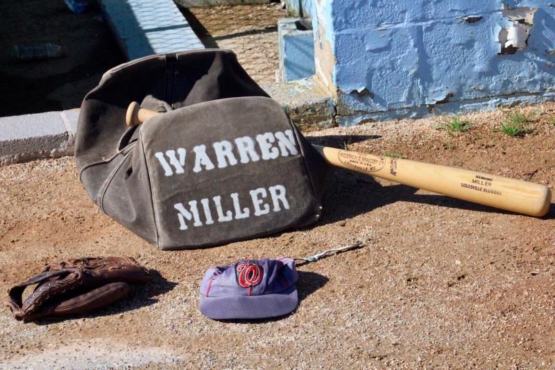 A lifetime of baseball has led to a lifetime’s worth of memorabilia for Warren Miller. The glove was used during his professional league seasons, the bag was made by the Yankees equipment manager in 1965, the hat is from his days in the Senators organization, and the R 43 bat was sent to him when he was at spring training. The R stands for Ruth. AARON MUSHRUSH PHOTO