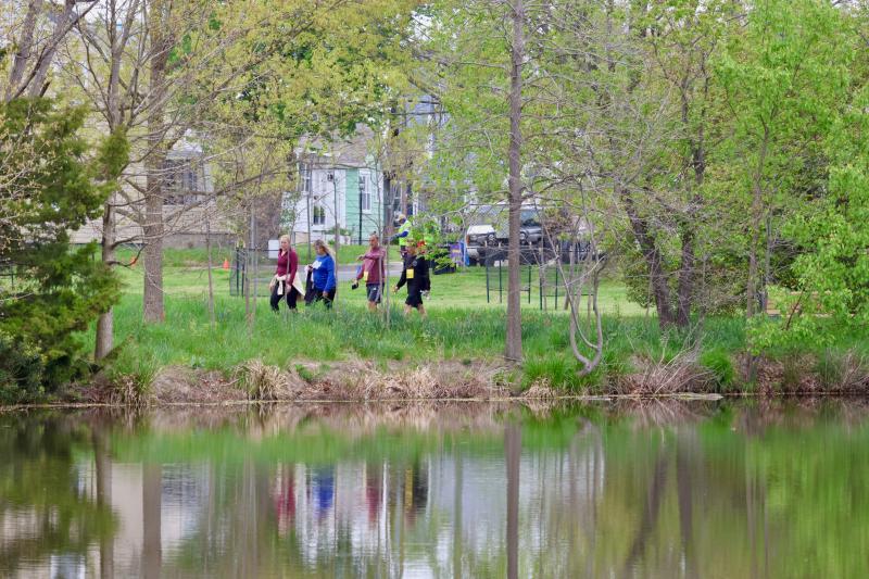 Some of the people who took part in the 5K run or one-mile walk make their way past Blockhouse Pond.