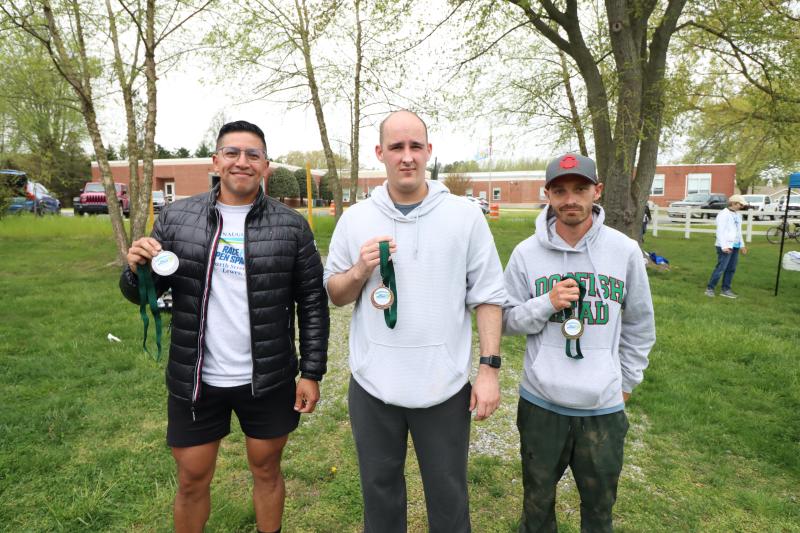 Showing off their medals as the top three finishers in the male 30-39 category are (l-r) Miguel DeLeon of Milton, Stinson Underwood of Dover and Joseph Goulet of Marydel.