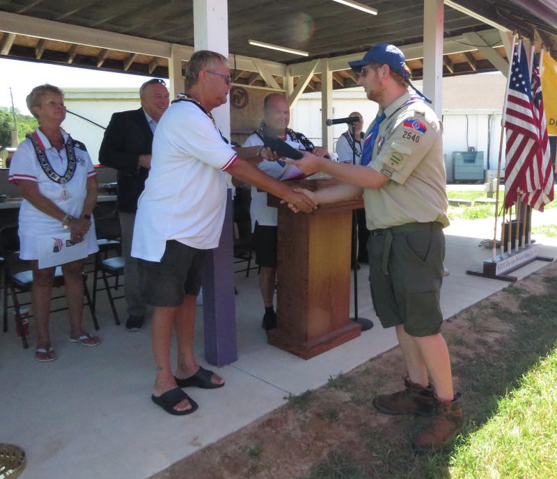 Exalted Ruler Buddy Hall-McBride presents a certificate of appreciation to Eagle Scout Matthew Hobman. In background are (l-r) Americanism Chair Terrie Bradley, Rep. Pete Schwartzkopf, Leading Knight Marty Schreck and PER Ralph Patterson.