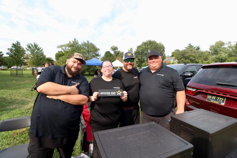 The team from Mission BBQ in Rehoboth Beach brought food to the event. Shown are (l-r) Brian Manson, Danielle Johnson, Ron Lewis and Tom Stachowski.