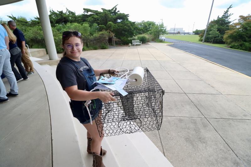 Haley Cylinder of Milford brought an old crab trap to get checked out for safety. She left happy because experts said the trap was in good shape and just needed a new line.