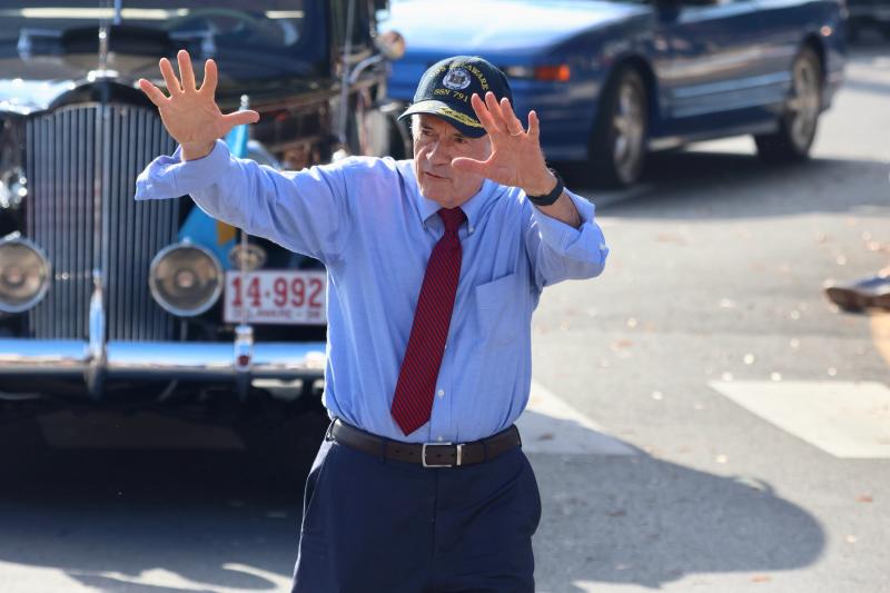 Sen. Tom Carper waves to the crowd during the Return Day parade. Carper is retiring after decades of service to Delaware.