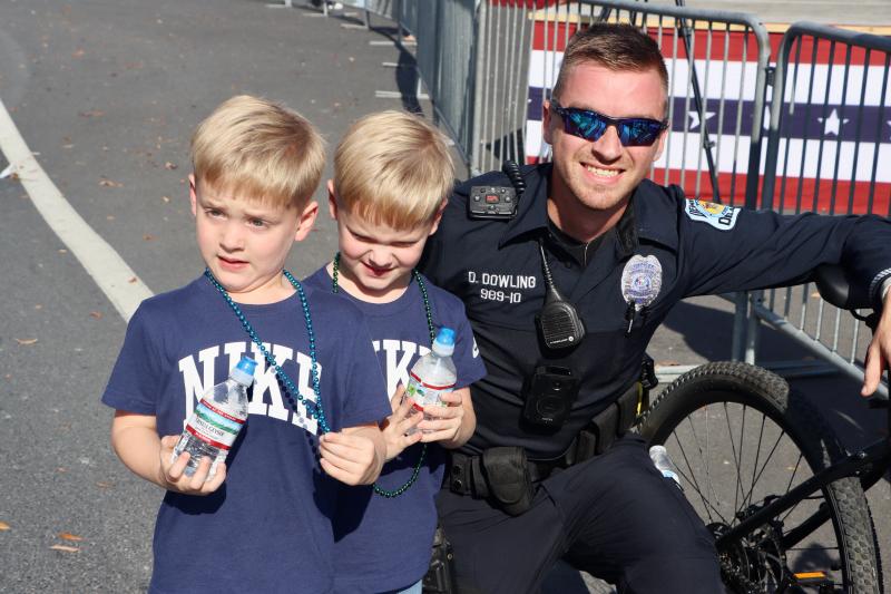 Twins Kaisen and Declan Waples, 5, of Millsboro could not wait to meet Georgetown police officer Dylan Dowling, because he was riding a bike to patrol the parade route.