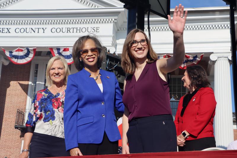 Lt. Gov. Bethany Hall Long, left, is joined Sen.-elect Lisa Blunt Rochester, center, and Rep.-elect Sarah McBride on the stage.