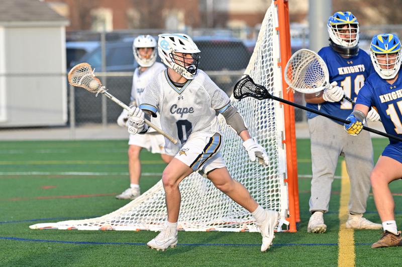 Cape senior Tanner Wyshock dodges around the Central goal crease. He scored three goals in the shutout of the Knights.