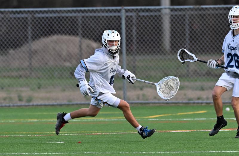 Cape sophomore goalie Patrick Little clears the ball after making one of his three saves in the game.
