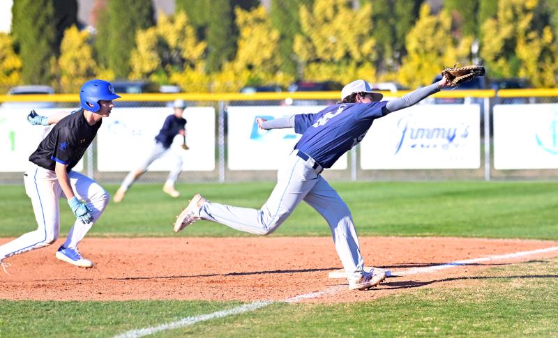 Cape sophomore first baseman Liam Mitchell snags a wide throw to save the baserunner from moving up to second.