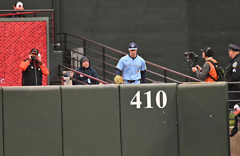 Bullpen coach Graham Johnson, right, gets the call for Mason Fluharty to enter the game in the seventh inning.