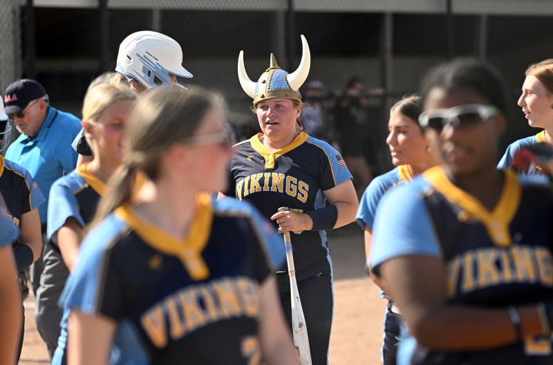 Alivia Heers wears the Viking helmet after slamming her homer in the first inning of the 10-2 win over the Royals.