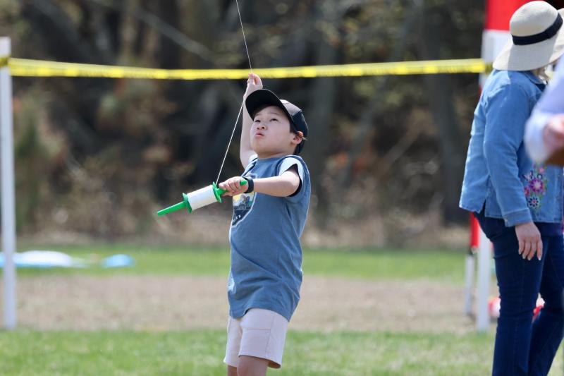 Charlie Choi from Lewes works hard to get his kite in the air. He did a great job, since he won second place for best store-bought kite.