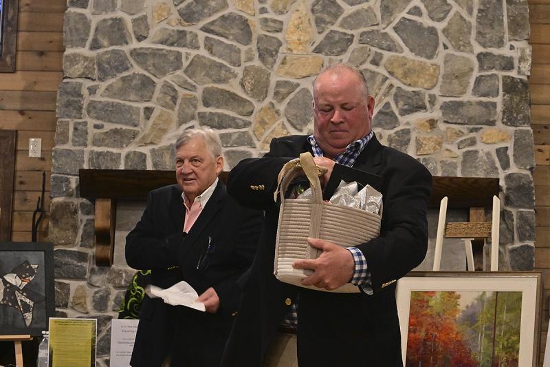 Butch Emmert, left, and John Kelleher of Emmert Auction Associates keep the auction humming right along.
