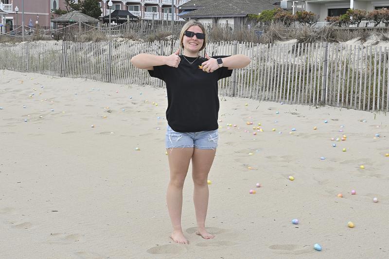Samantha Swift, summer manager at Rehoboth Toy & Kite Company, is all thumbs-up, not only for the egg hunt, but also for summer.